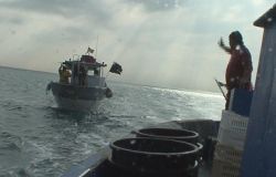 pescatori dinanzi al litorale di Ostia